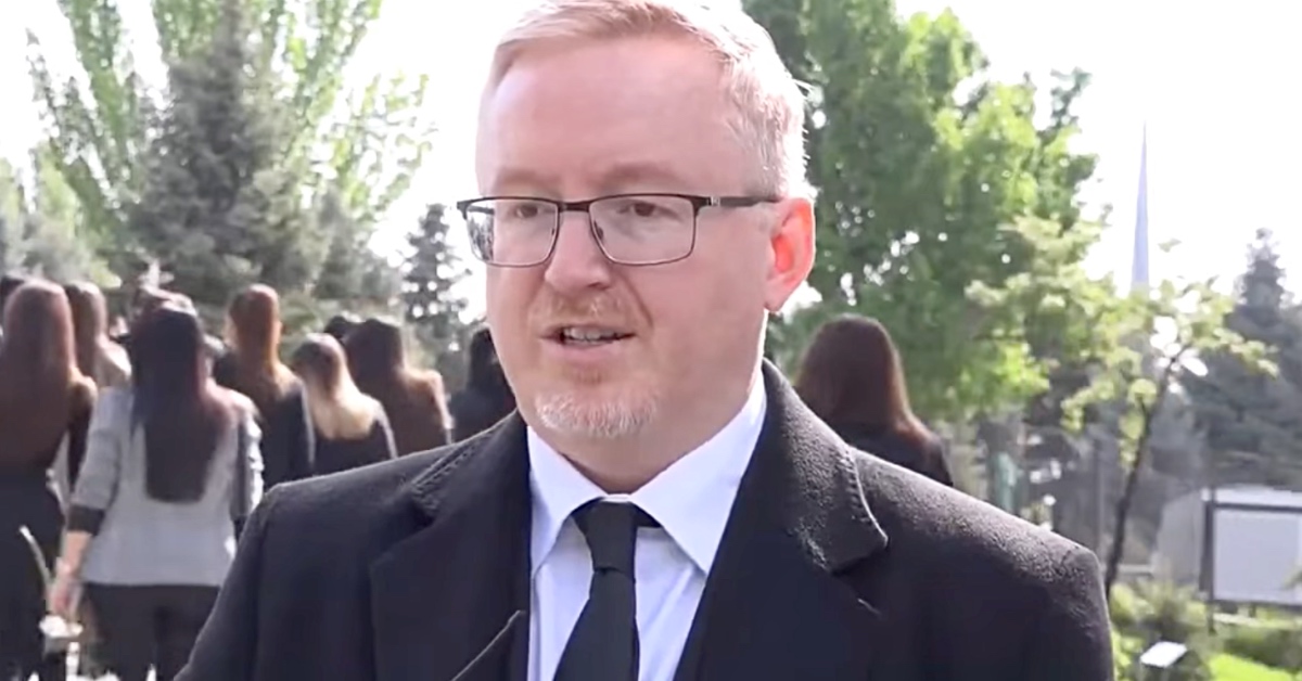 Ambassador Andrew Turner speaks at the Armenian Genocide Memorial in Yerevan during the 110th anniversary commemoration.
